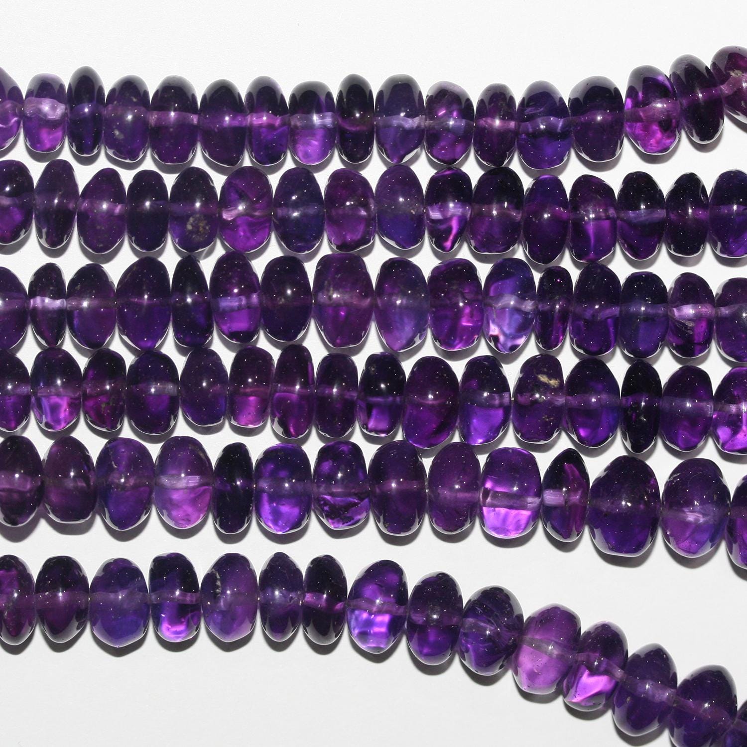 Cuentas redondas lisas de amatista de 16" (8 x 5-11 x 7 mm) graduadas. Longitud aproximada: 40 cm.