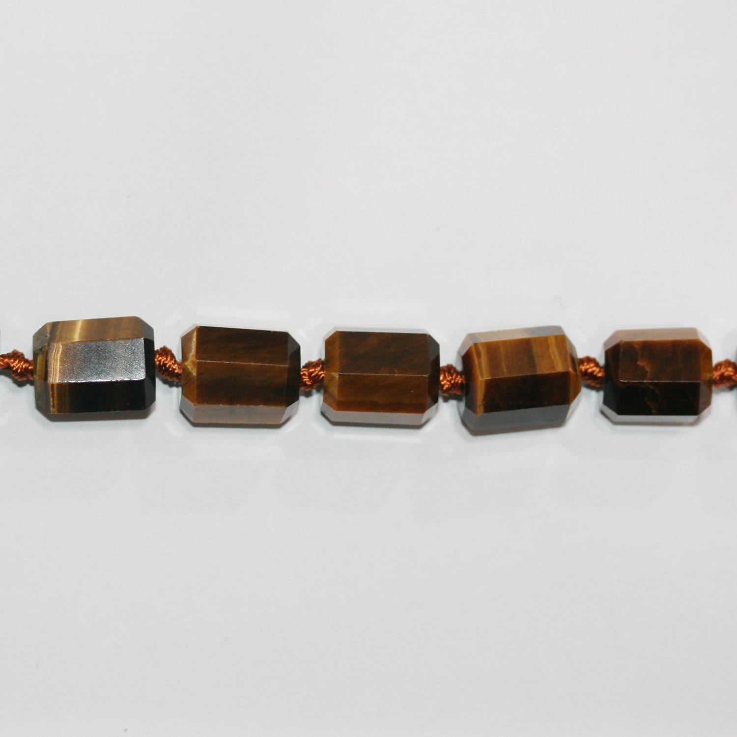 Cuentas de barril facetadas de ojo de tigre de 16" de St. 15 x 12 mm - Hilo de 40 cm.