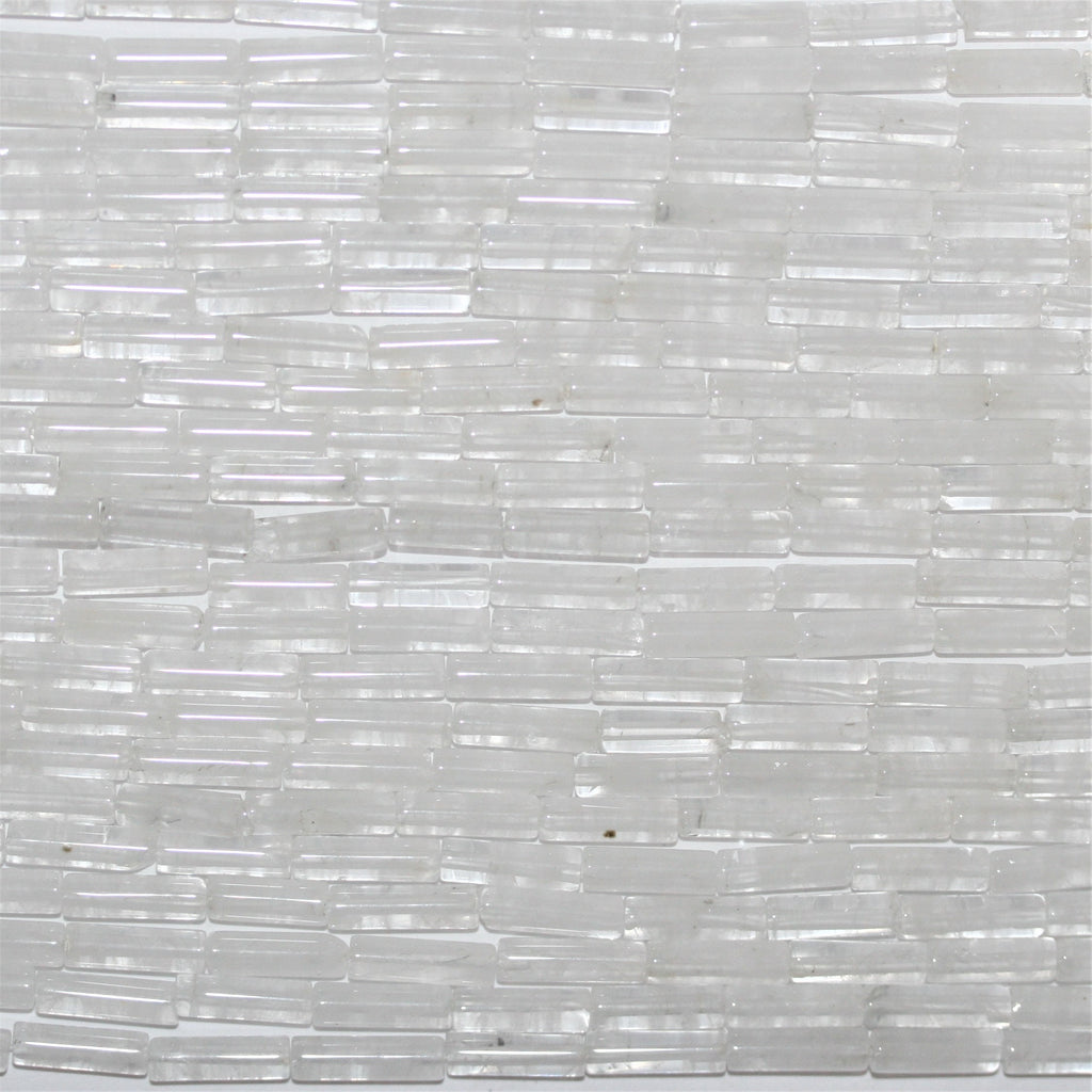 Perles tubulaires lisses en cristal de roche de 15 pouces, 13 x 4 mm. - Brin de 39 cm.