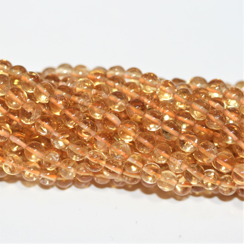 Perles rondes lisses de citrine 4 mm - Fil de 38 cm.