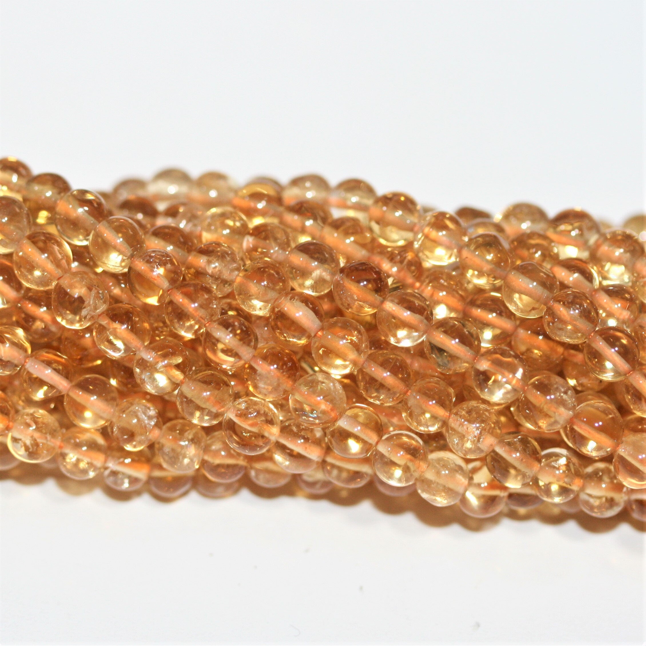 Perles rondes lisses de citrine 4 mm - Fil de 38 cm.