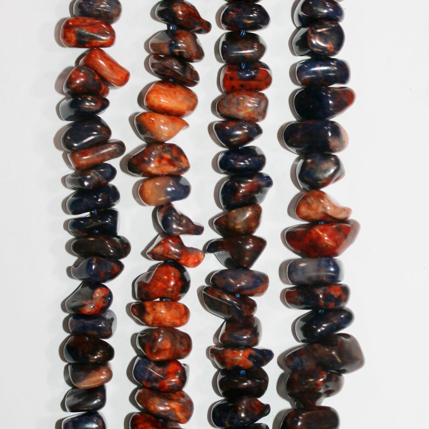 Cuentas de sodalita azul-marrón lisas de 16" (10-12 mm). Aprox. - Hilo de 40 cm.