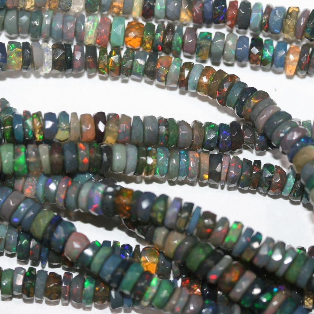 Cuentas redondas facetadas de ópalo etíope negro de 40 cm. 8,5 x 3 mm - 4 x 2 mm. Hilo de 40 cm.