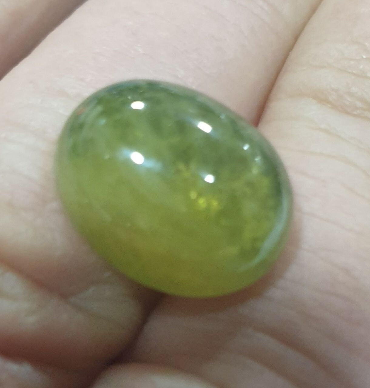Green Sapphire Oval Cabochon 15x12mm.(15.9ct.).