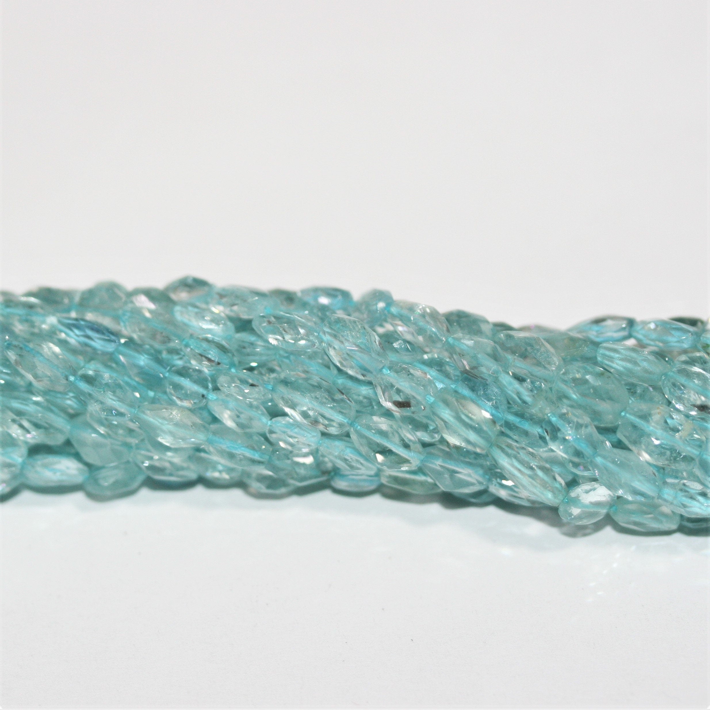 13" St Aquamarine Faceted Oval Beads 6x4mm.-Strand 34cm.