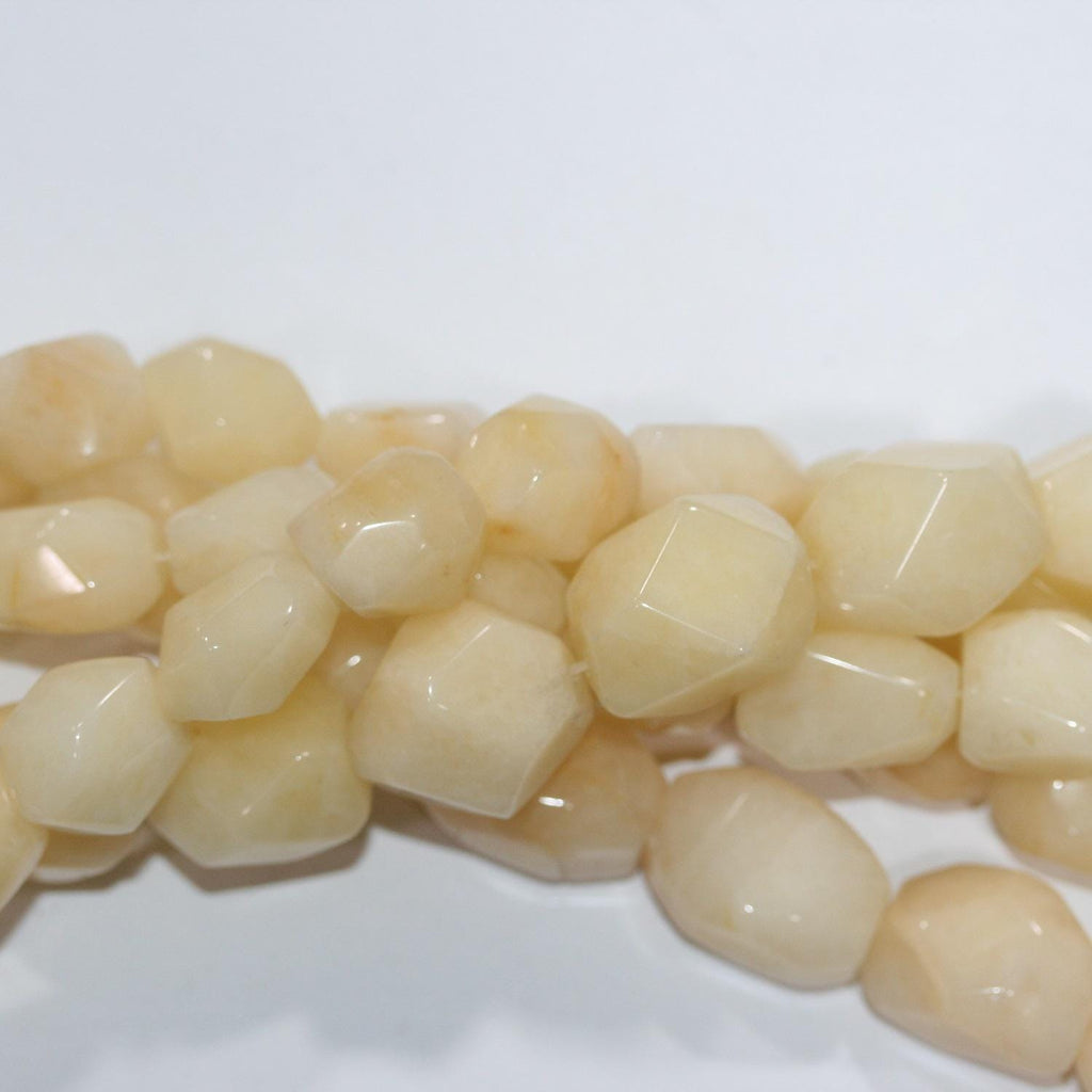 Cuentas de jade amarillo facetadas de 16" (17 x 15 mm). Hilo de 40 cm aprox.