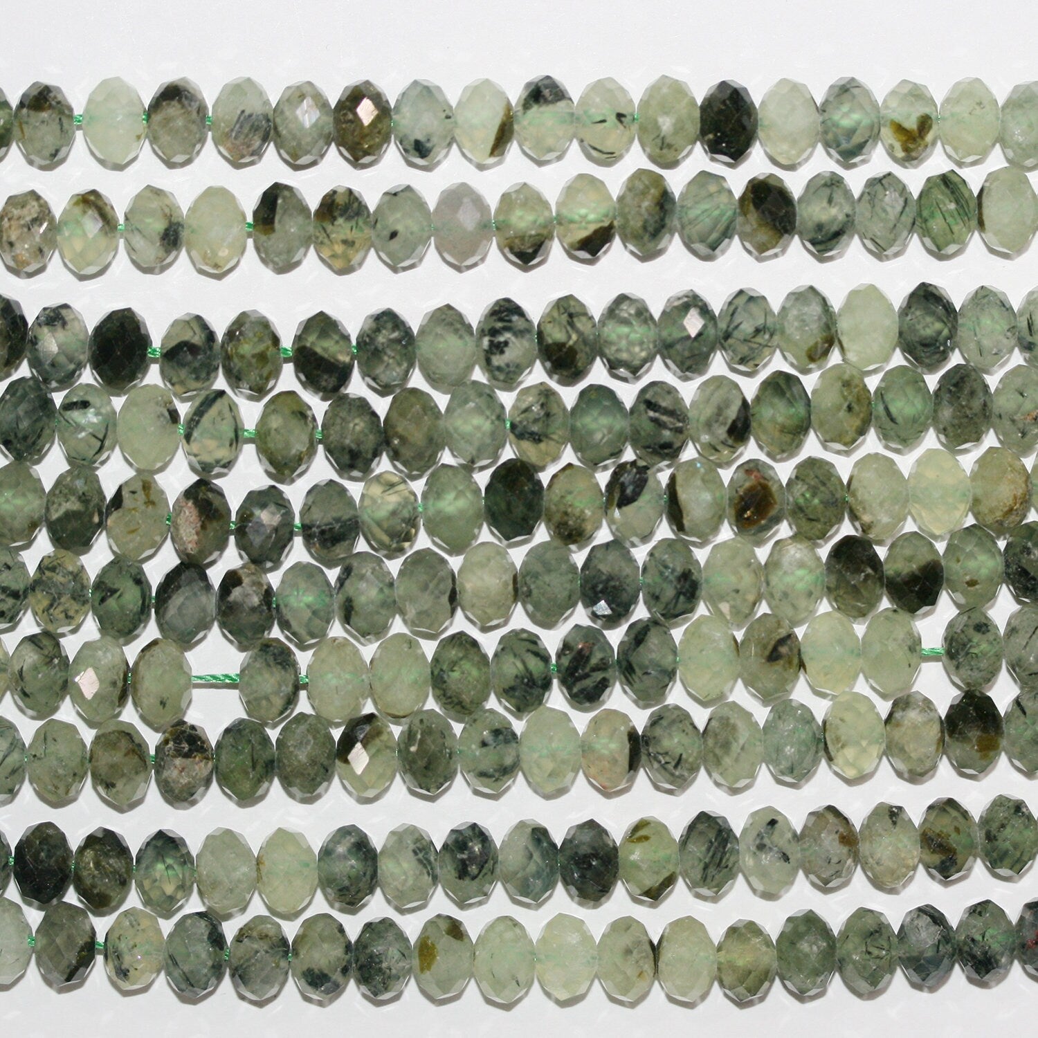Perles rondelles à facettes en stréhnite 15" 8x5mm.- Brin 39cm.