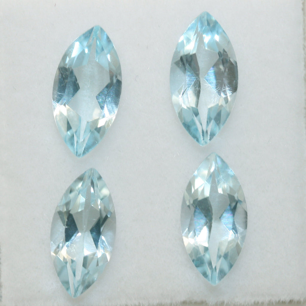 Lot de topazes bleu ciel facettées en forme de marquise 10x5mm.-(4 pièces).