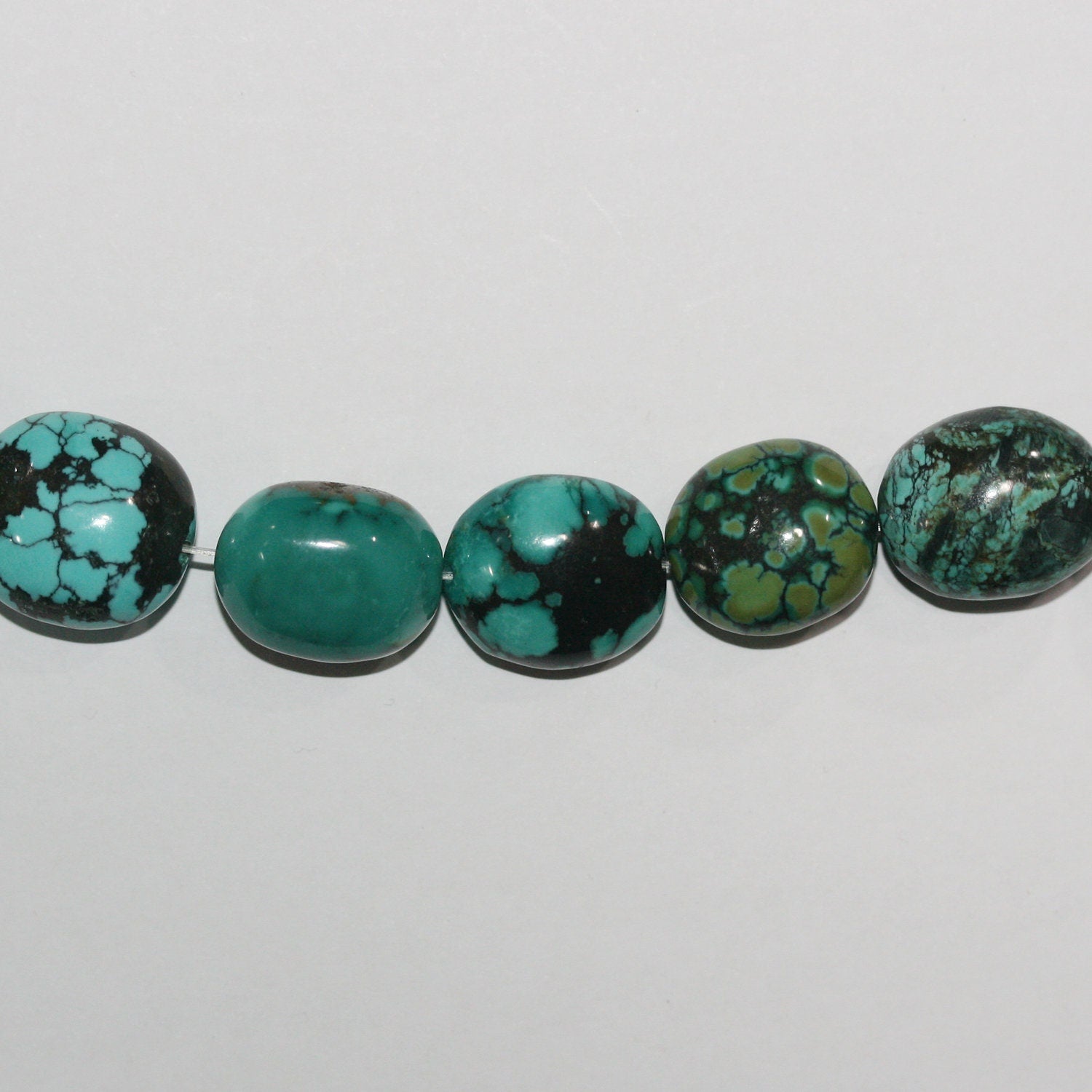Cuentas ovaladas lisas de color turquesa de 16" x 19 x 16 mm aprox. - Hilo de 40 cm.