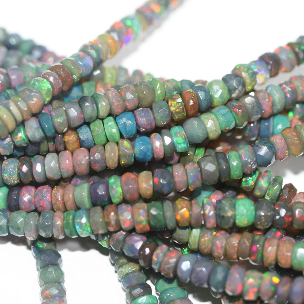 Cuentas redondas facetadas de ópalo etíope negro de 40 cm. 6,4 x 3,4 mm - 3,3 x 2,5 mm. Hilo de 40 cm.