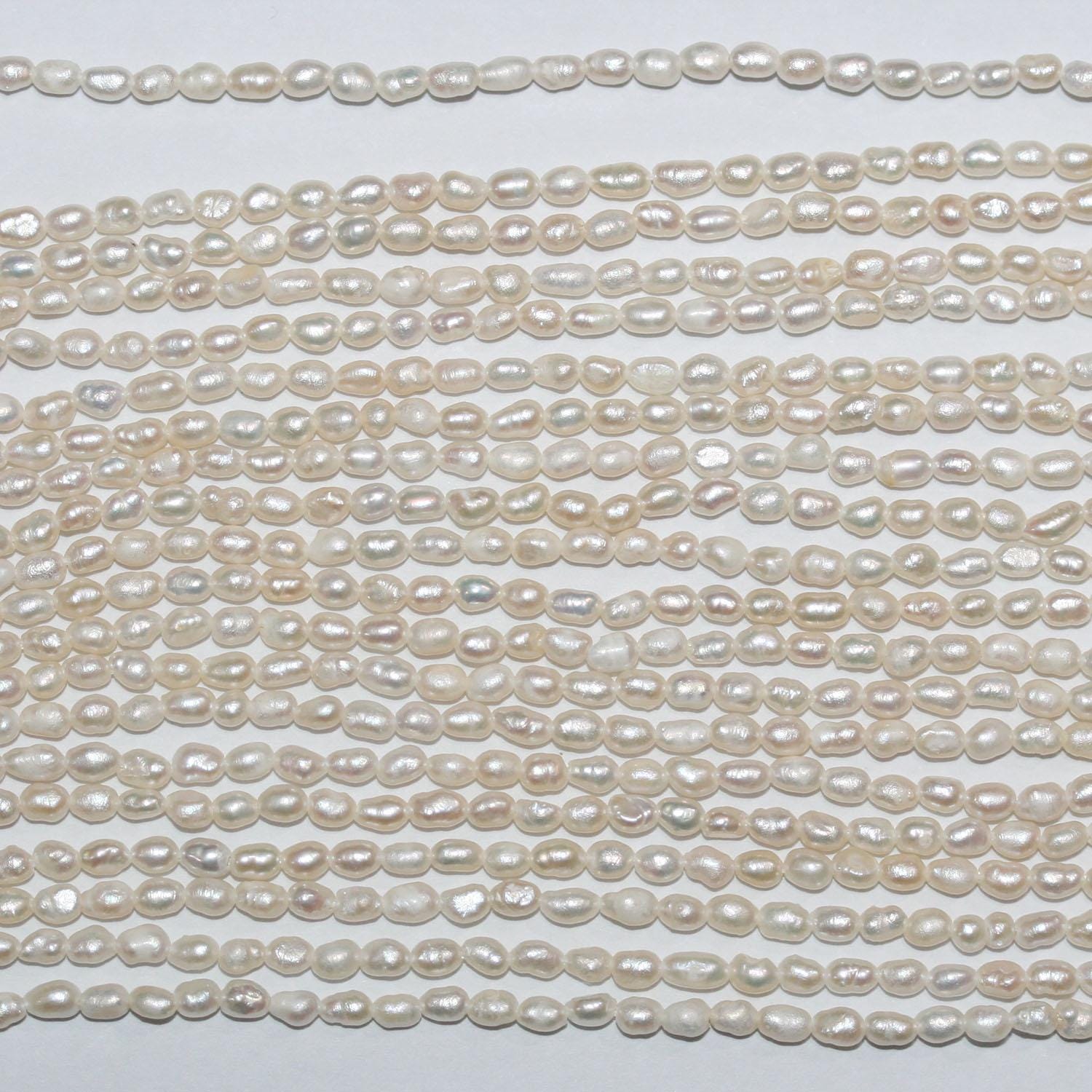 Perla de agua dulce ovalada de 14" (2-2,5 mm) - Hilo de 37 cm - Precios al por mayor de perlas naturales