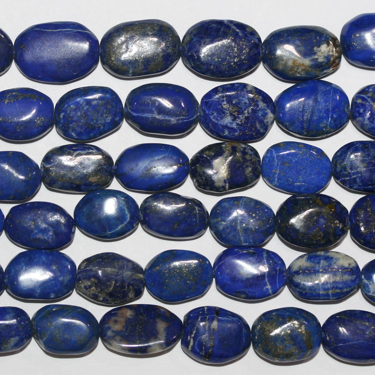 Cuentas ovaladas lisas graduadas de lapislázuli de 40 cm (16"), 10 x 7-18 x 13 mm (aprox.), tira de 40 cm