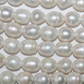 Perles ovales d'eau douce de 38 cm (percées à 2,50 mm), diamètre 12-13 mm, longueur 38 cm. Perles naturelles à prix de gros.