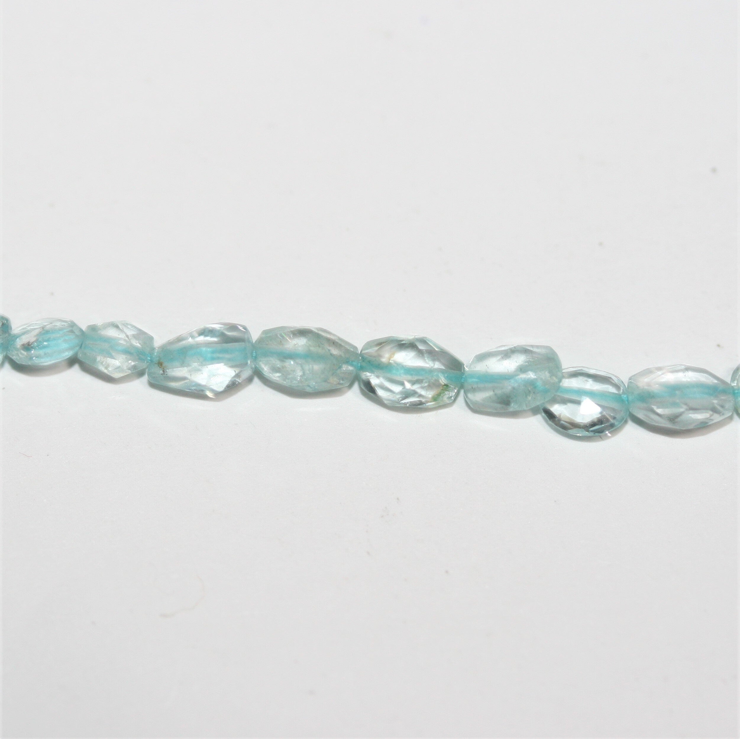 13" St Aquamarine Faceted Oval Beads 6x4mm.-Strand 34cm.
