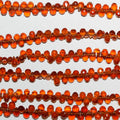 Perles en grenat spessartine facetté 9" (6 x 4 mm) - Fil de 23 cm