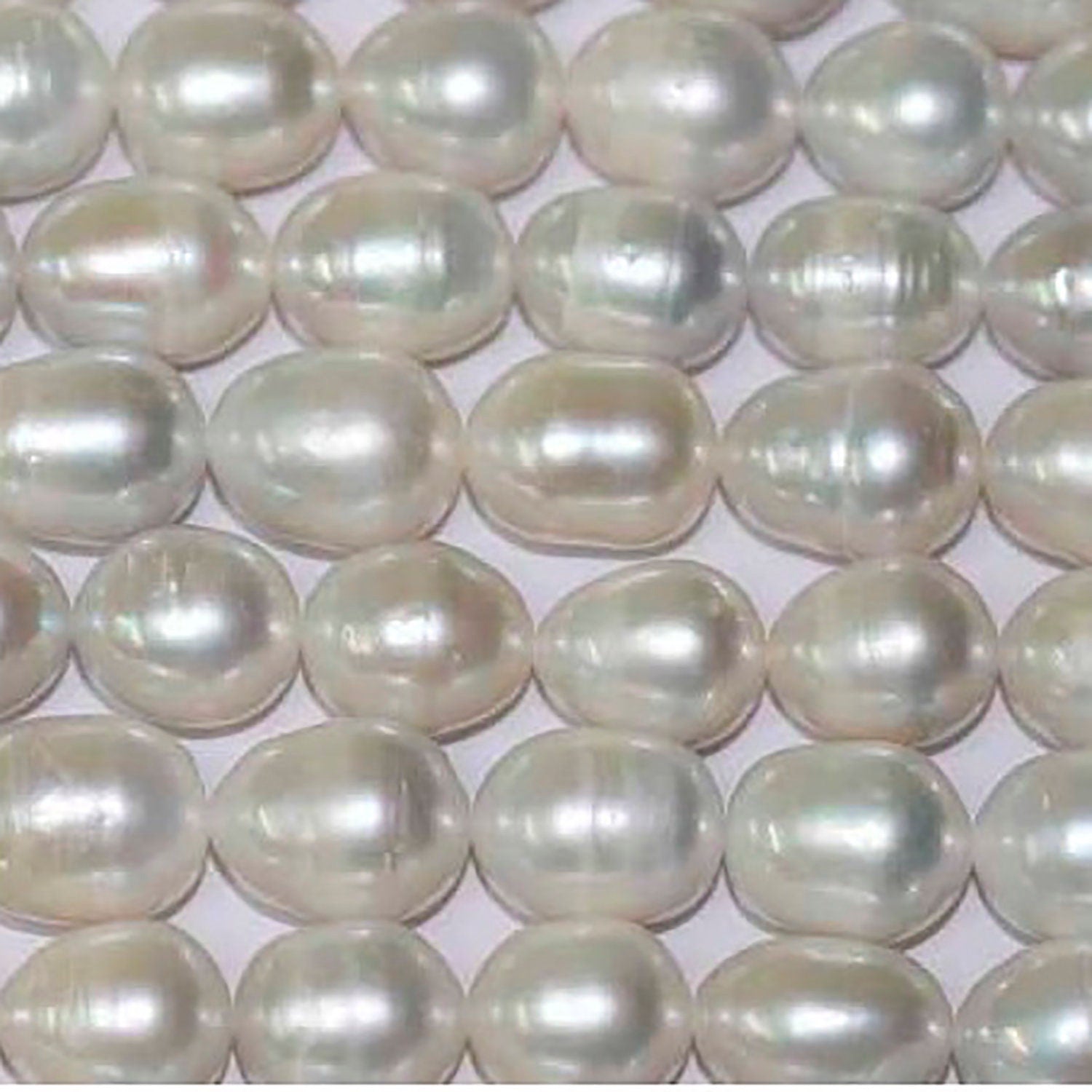 Perla de agua dulce ovalada de 15" (11-12 mm) - Hilo de 39 cm - Precios al por mayor de perlas naturales