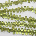 Perles en péridot facettées de 8 pouces (7 x 4 mm). Longueur approximative du fil : 20 cm.