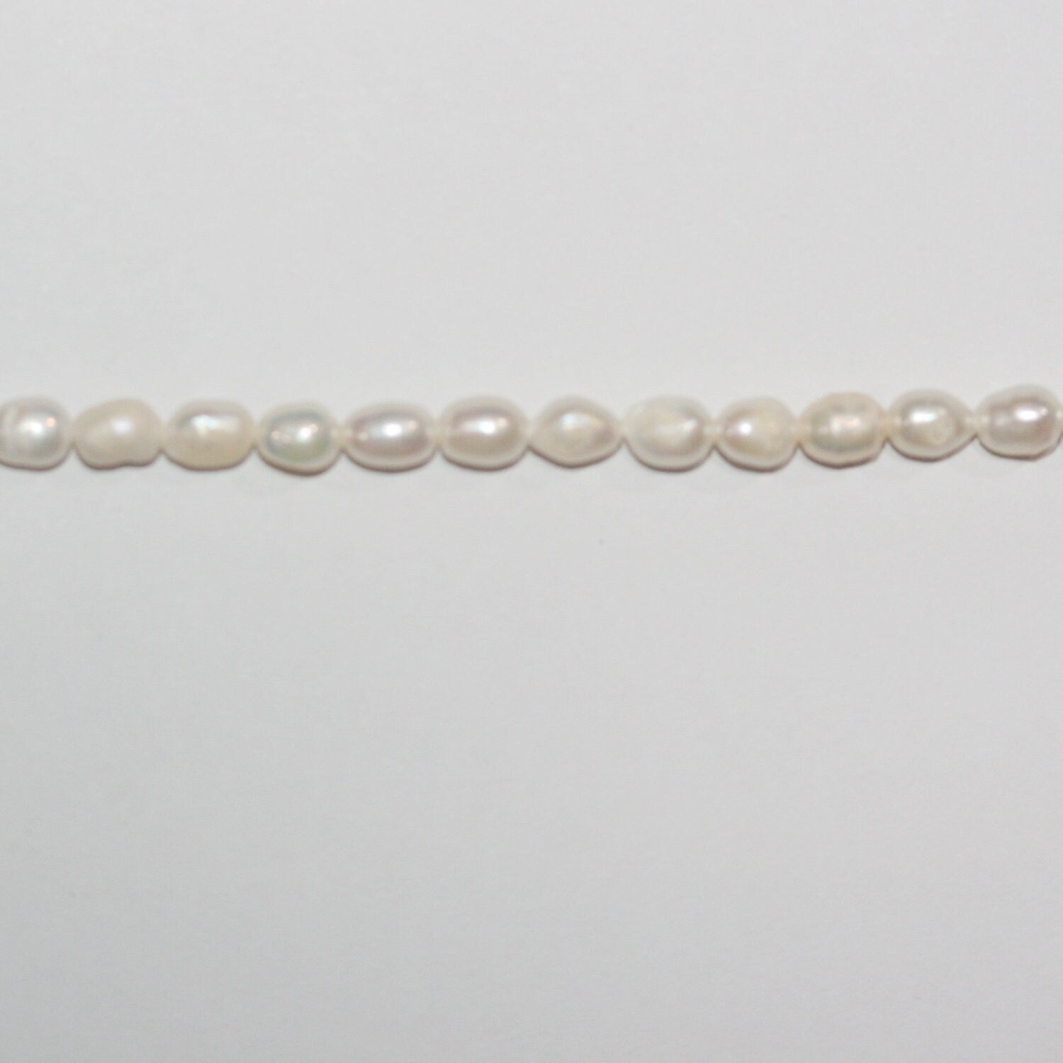 13" St FreshWater Oval Pearl 5-6mm.-Strand 35cm. -Natural Pearls wholesale Prices