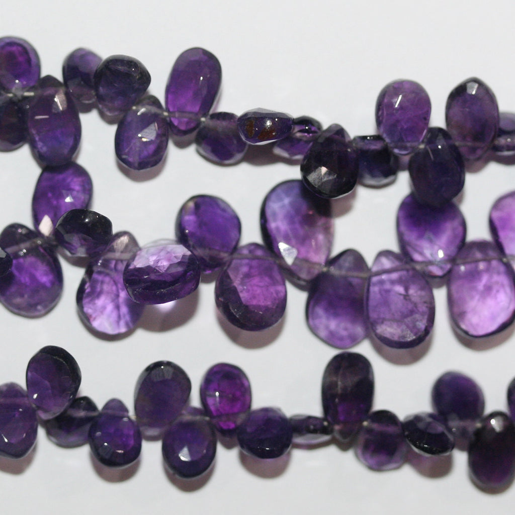 Cuentas de amatista facetadas de 8" x 7 x 5 mm (aprox.), hilo de 20 mm.