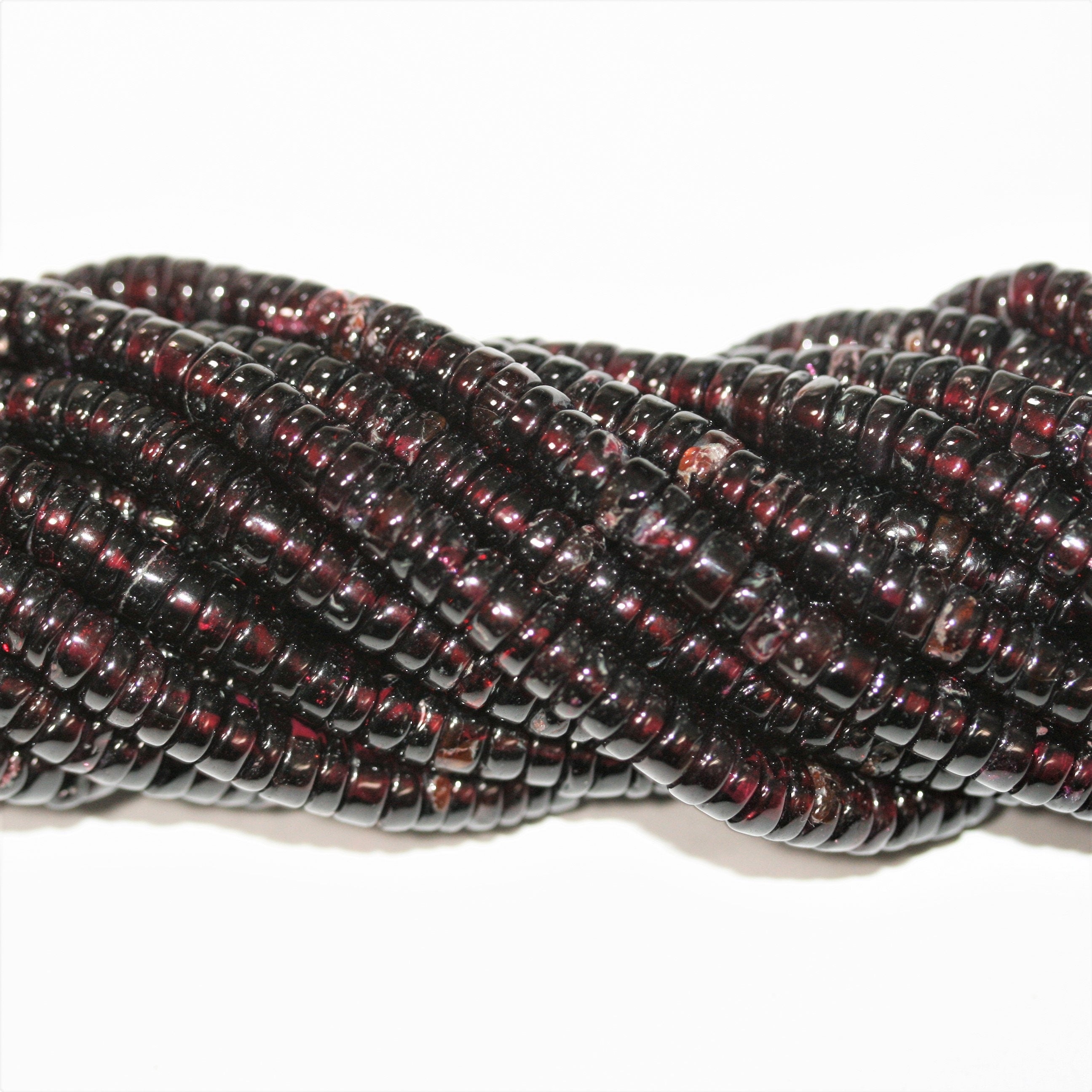 13" St Garnet Smooth Disc Beads 5x2mm.- Strand 33cm.