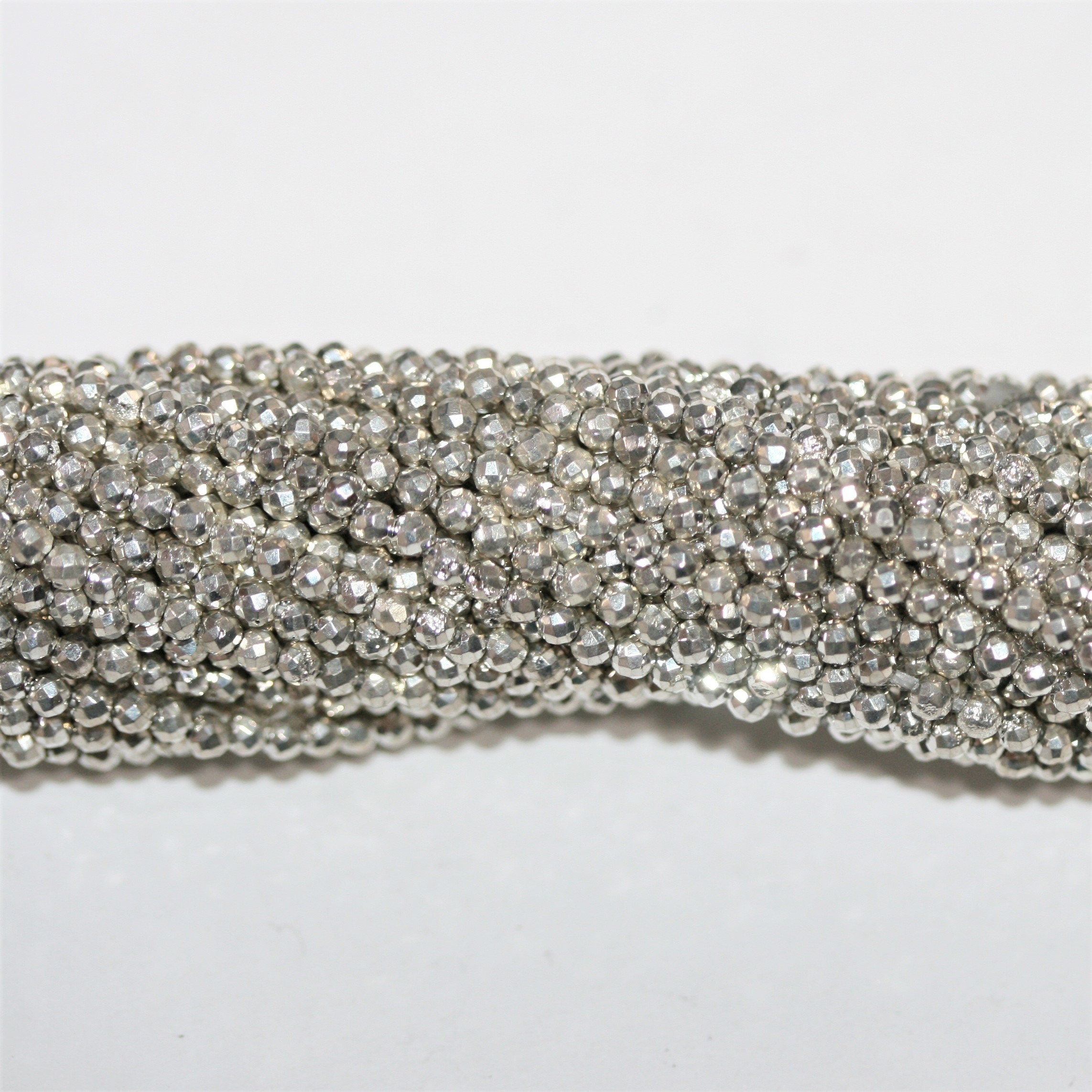 13" St. Silver Pyrite Faceted Round Beads 2mm.- Strand 34cm.