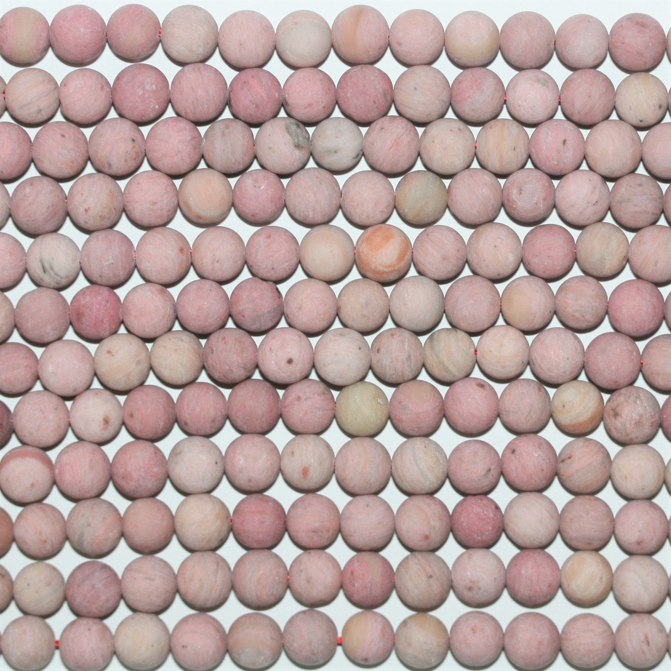 Perles rondes lisses en rhodonite mate 8 mm - Fil de 39 cm.