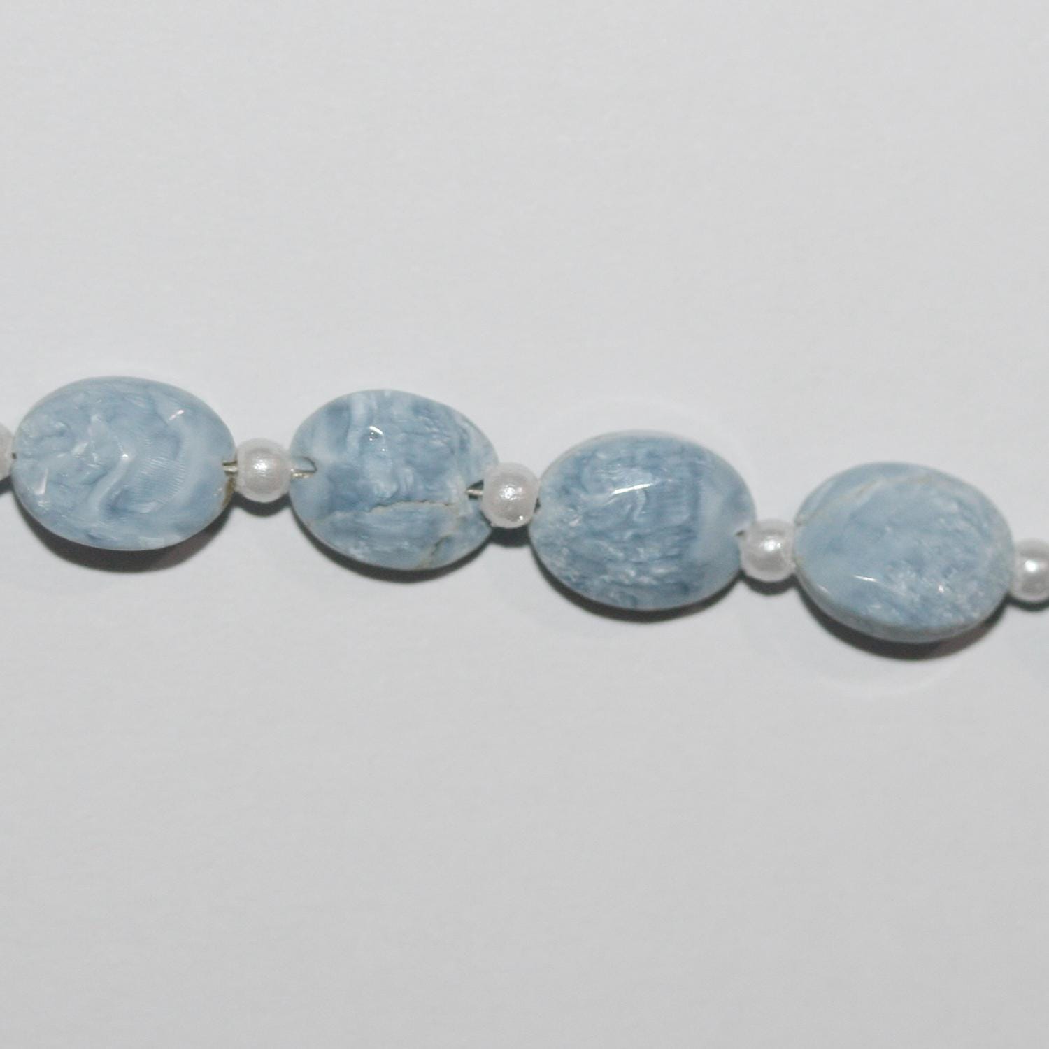 Cuentas ovaladas facetadas de ópalo azul de 16" de 9 x 7 mm - Hilo de 20 cm.