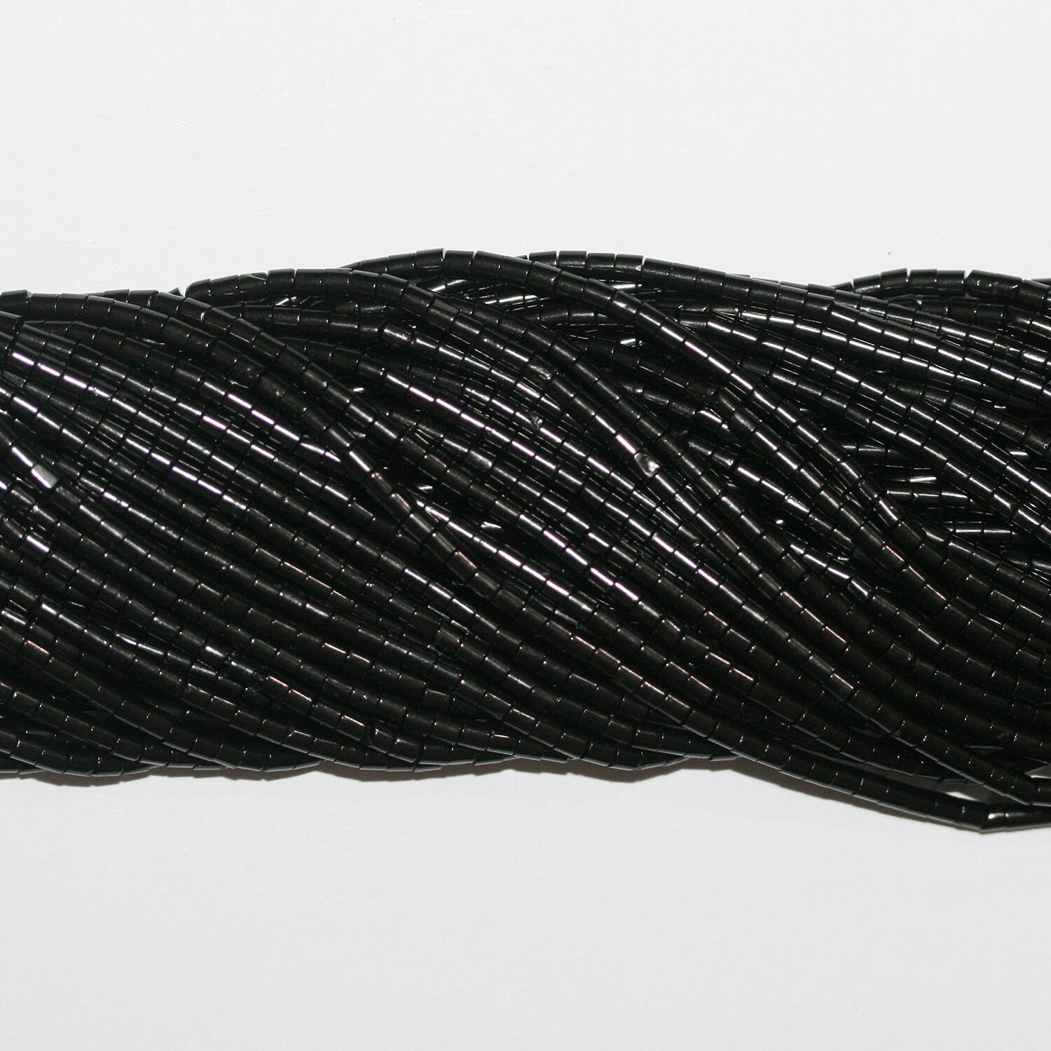 Perles disques lisses St Jet 15" 2x1,5mm.-Bracelet 39cm.