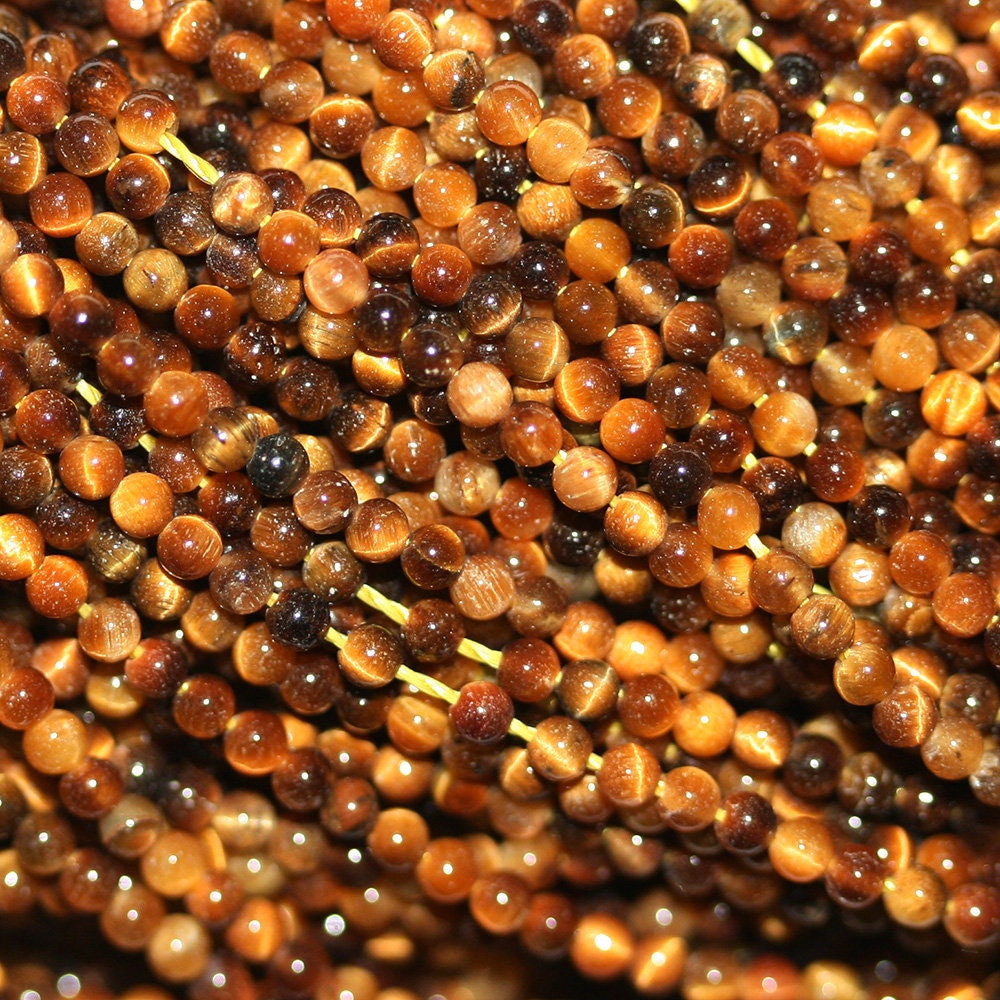 Perles rondes lisses œil de tigre St 15" 2 mm - Fil de 39 cm