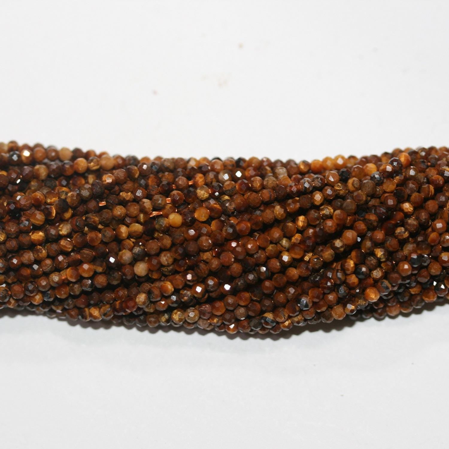 Cuentas redondas facetadas de ojo de tigre de 40 cm (16"), 2 mm (tira de 40 cm) - Artículo 14850