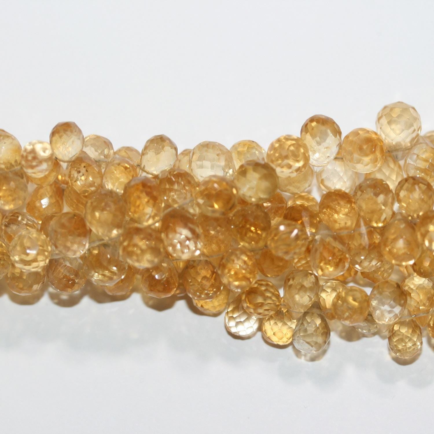 Perles en citrine facettées en forme de goutte, 7 x 5 mm environ, 20 cm de long.