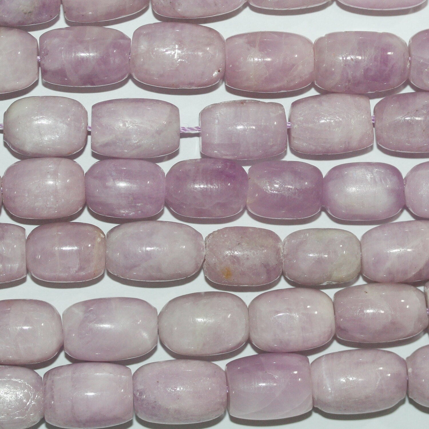 Perles cylindriques lisses en kunzite St de 15 pouces (16 x 10 mm). Longueur approximative du fil : 39 cm.