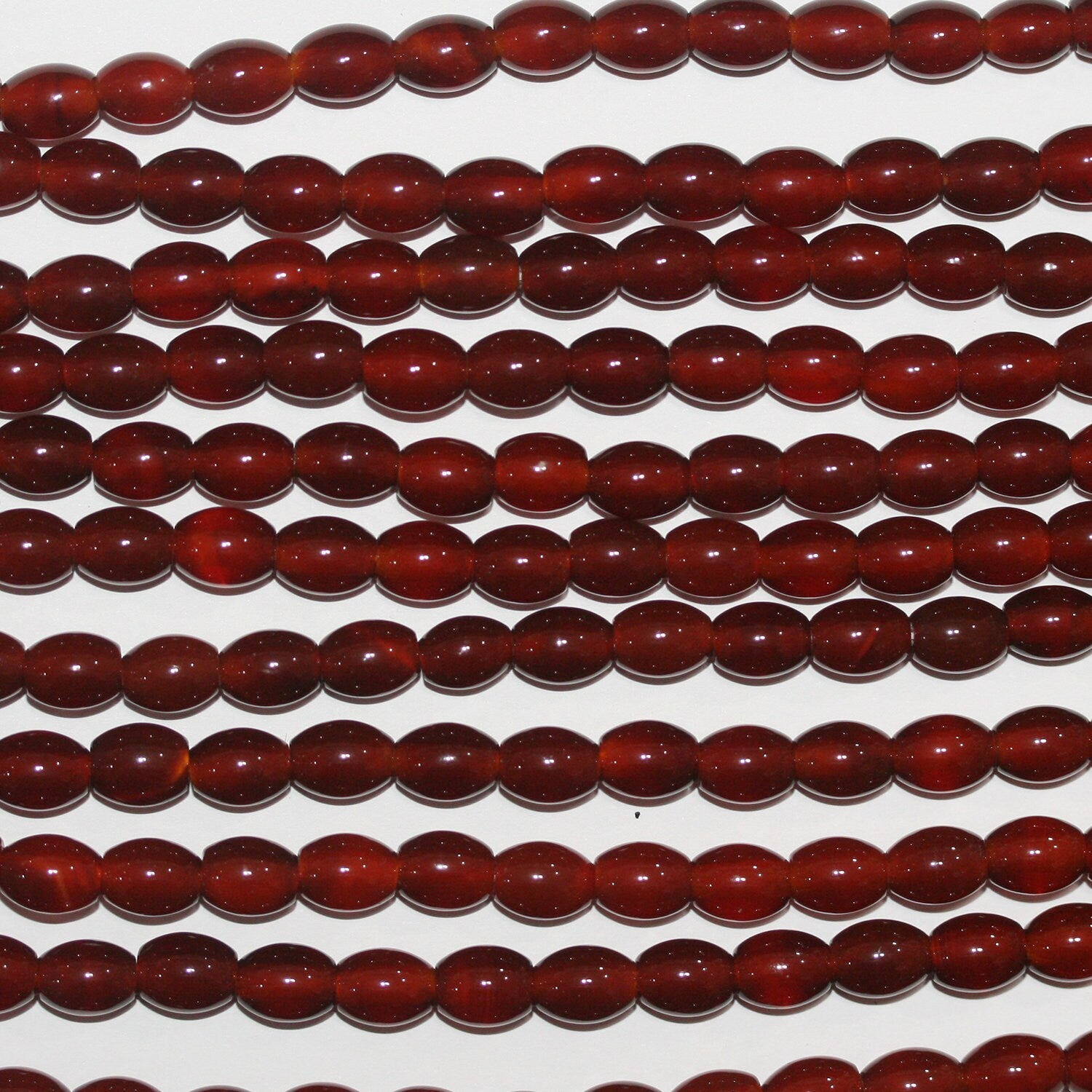 16" Cuentas de barril liso de Santa Cornalina 8x6 mm.-Hilo 40 cm.