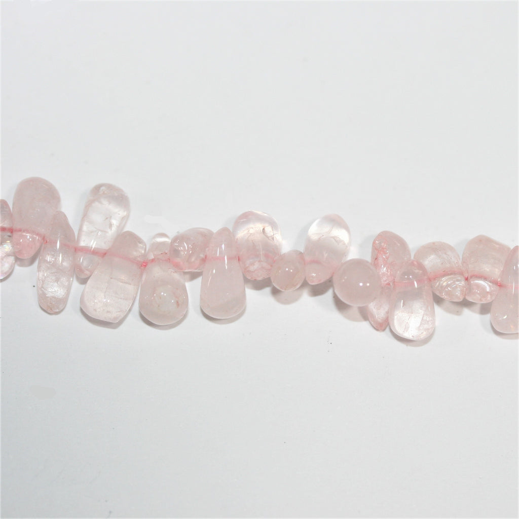 Perles en quartz rose lisses en forme de goutte, 10 x 5 mm environ - Longueur du fil : 36 cm.