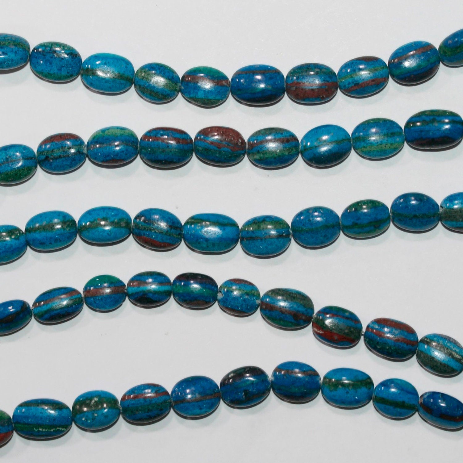 Cuentas ovaladas lisas de calcita azul de 8" 9x7 mm - Hilo de 21 cm.
