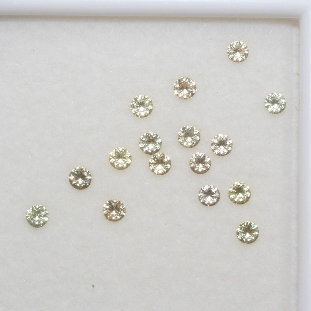 Lote de zafiro amarillo redondo facetado de 2,3 mm. Aprox. 1 quilate.