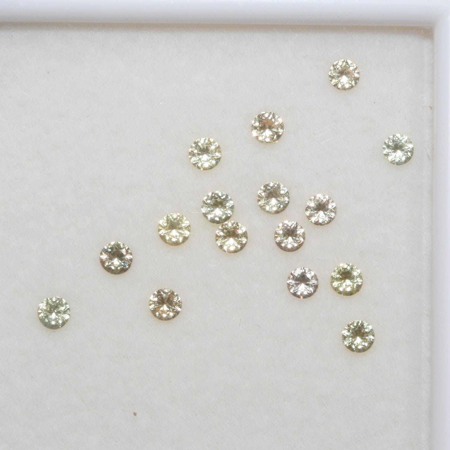 Lote de zafiro amarillo redondo facetado de 2,3 mm. Aprox. 1 quilate.