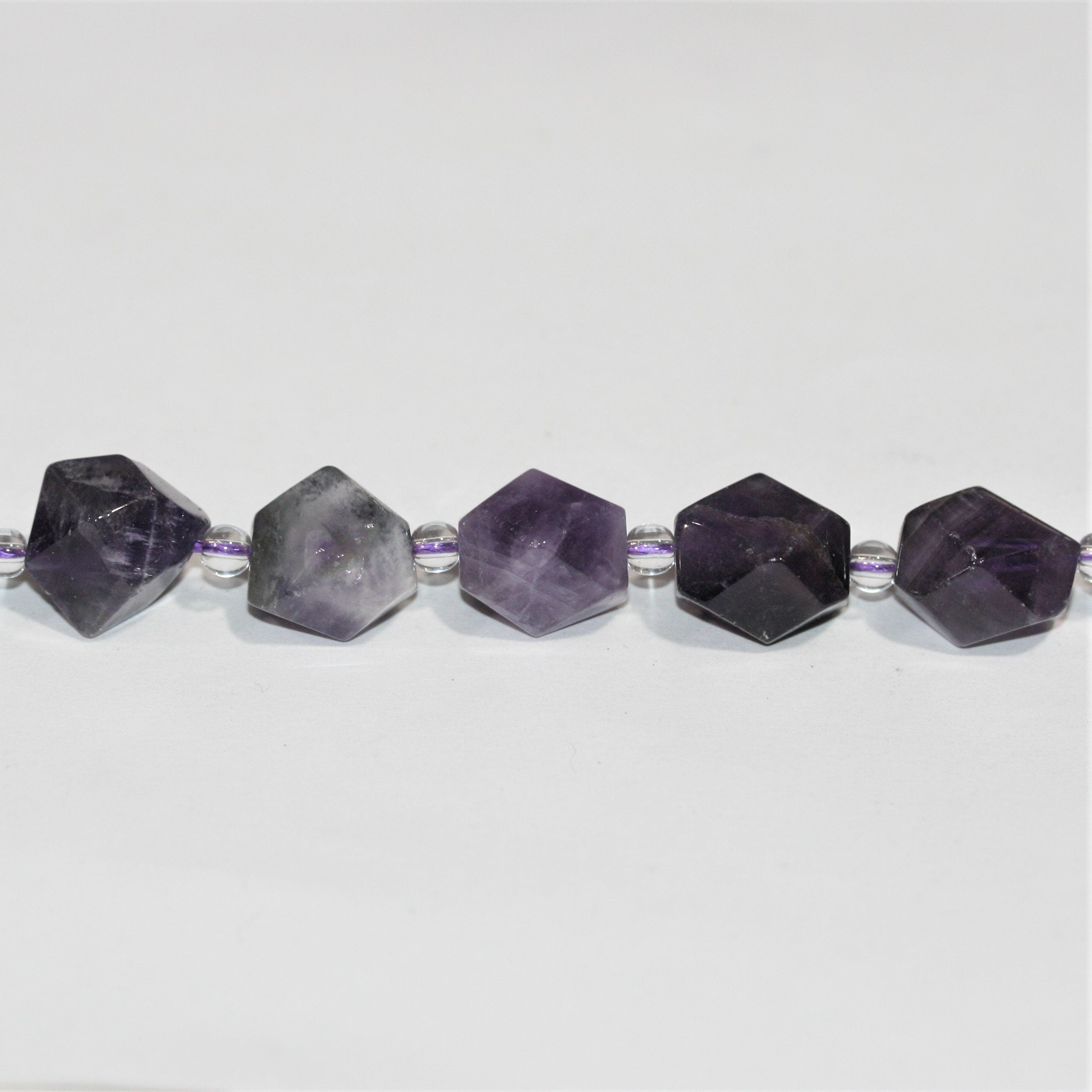 Cuentas facetadas de amatista santa de 16", 15 x 10 mm. Longitud aproximada: 40 cm.