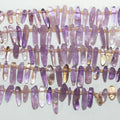 Perles bâtonnets lisses dégradées en Sainte-Amétrine, 15 pouces (11 x 4 à 23 x 8 mm). Longueur approximative du fil : 39 cm.