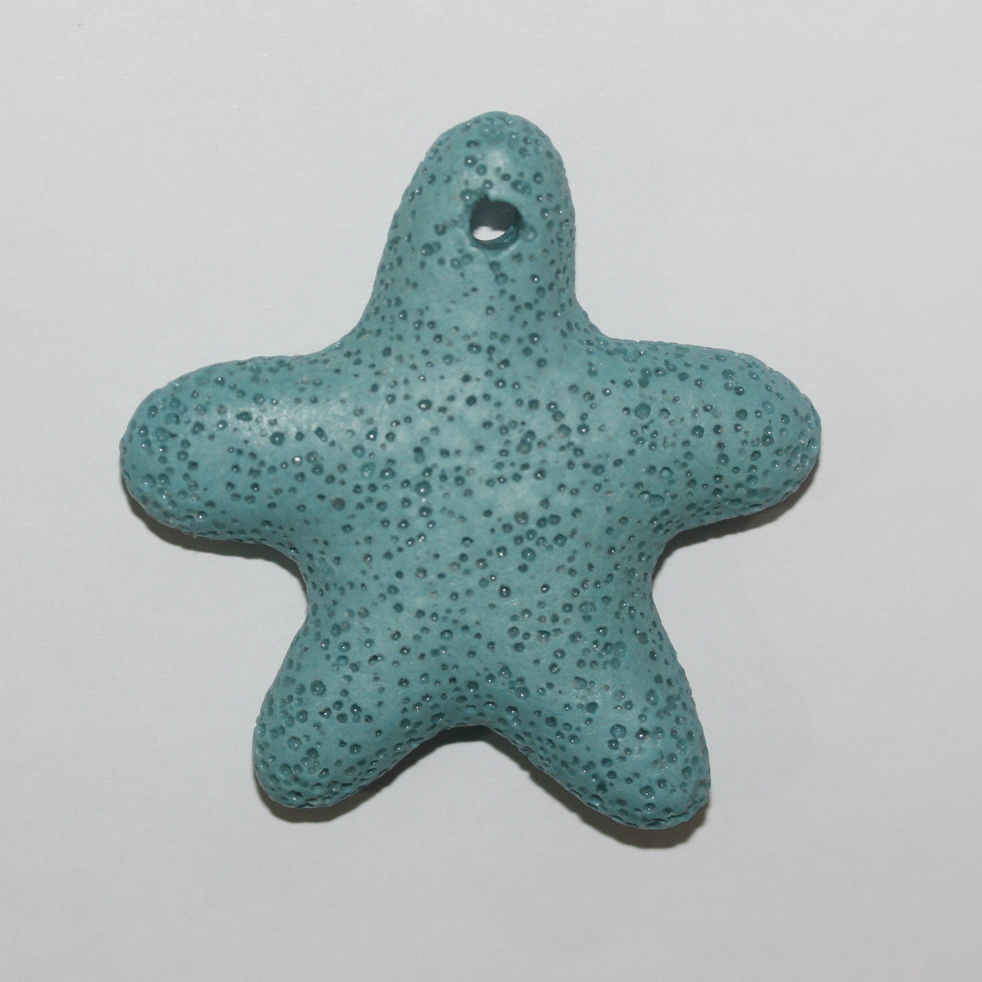 Colgante Estrella de Lava Blanca 50mm.