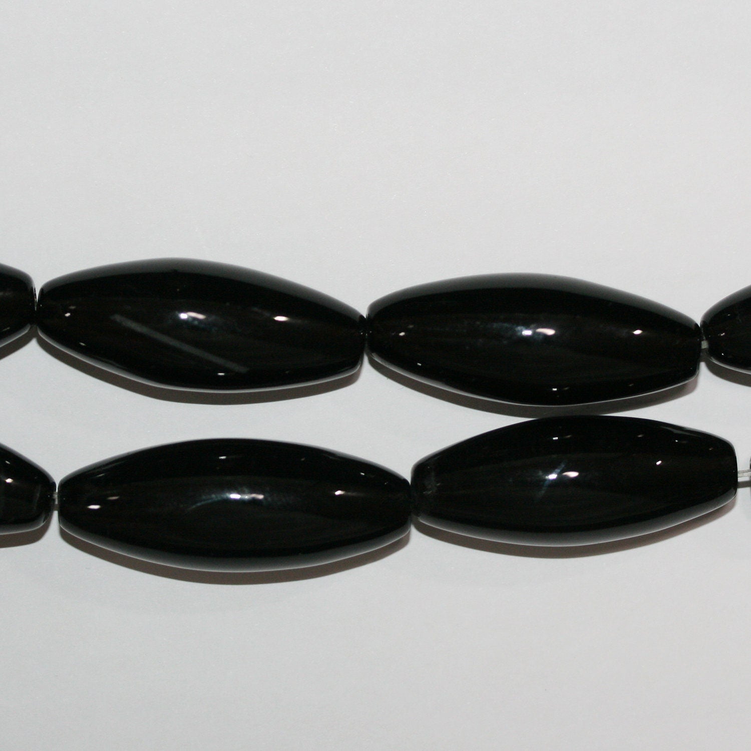 Cuentas de ónix St. de barril liso de 40 x 14 mm (16") - Hilo de 40 cm