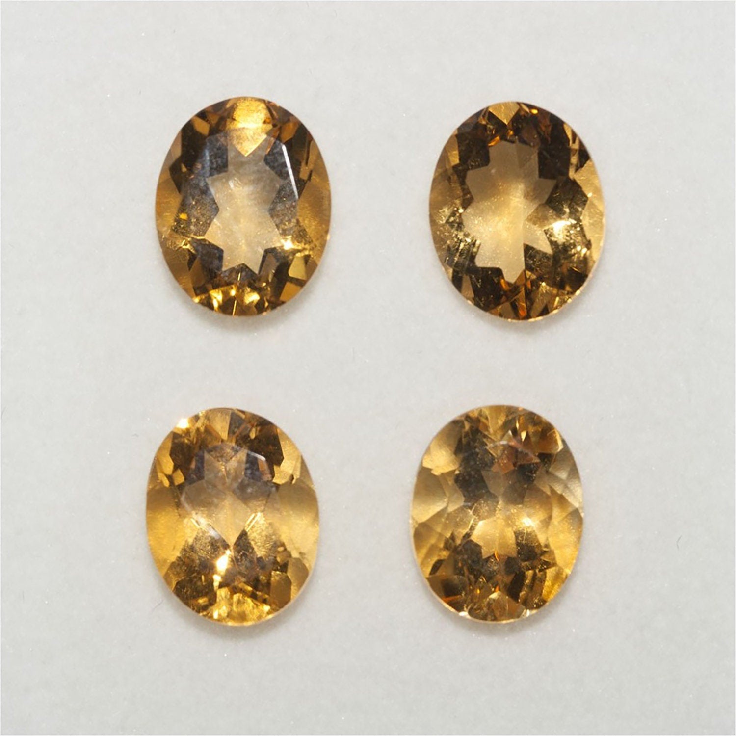 Lote de 4 citrinos ovalados facetados de 10 x 8 mm (4 unidades)