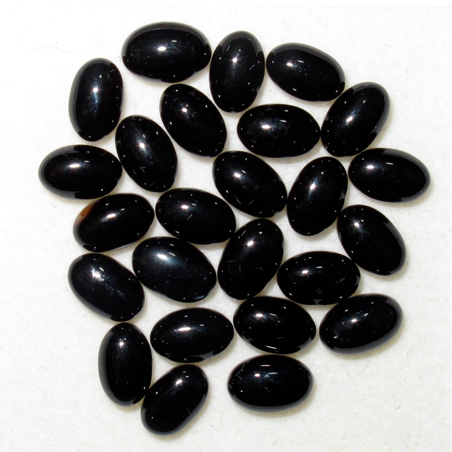 Lote de 25 piezas de cabujón ovalado de ónix de 6x4 mm. (25 uds.)