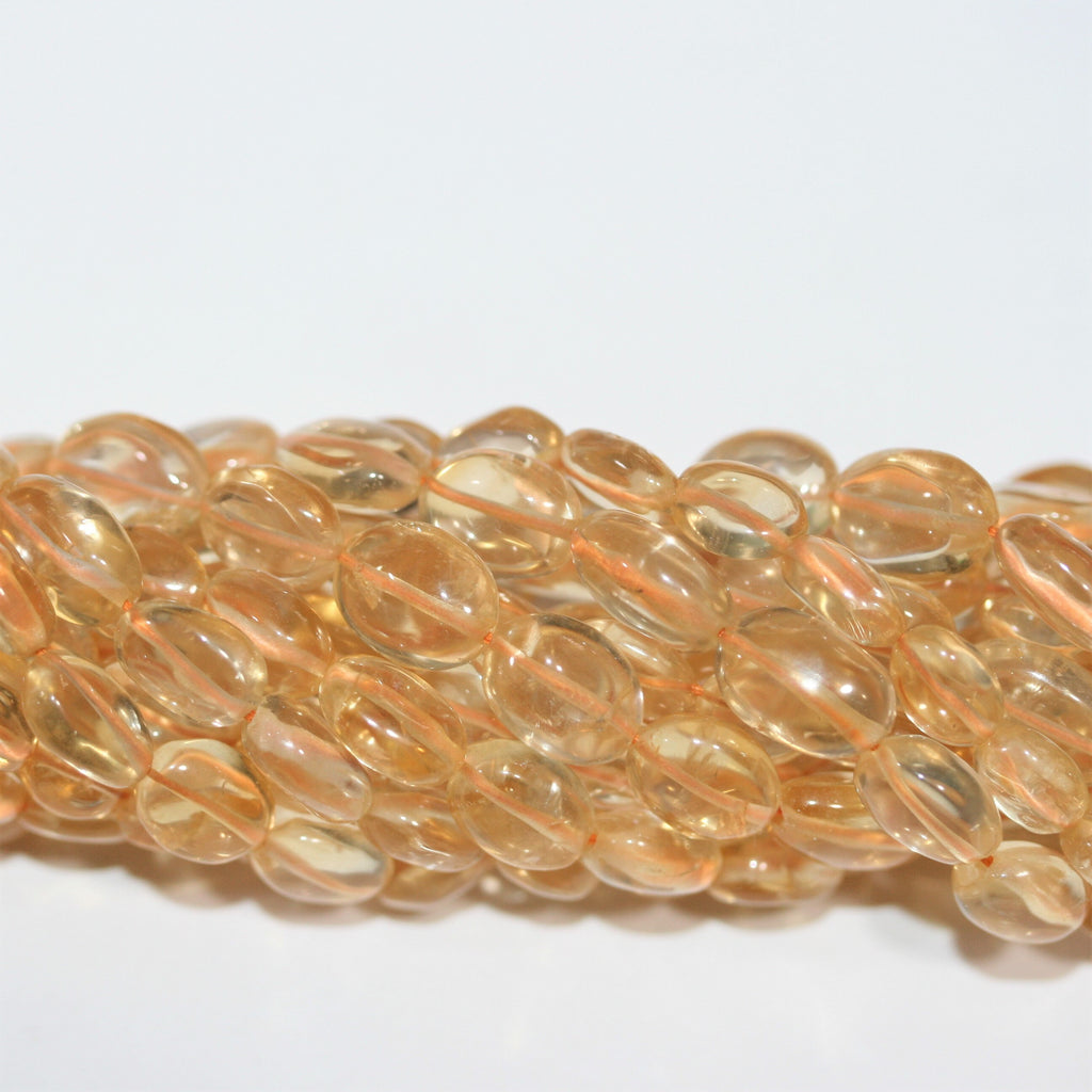 Perles ovales lisses de citrine 10x8mm environ - Fil de 37cm.