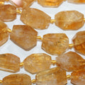 Perles de citrine facettées en forme de pépite de 15 pouces (26 x 14 mm). Longueur approximative du brin : 39 cm.