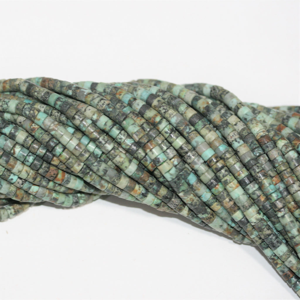 Perles disques lisses en turquoise africaine St 15" 4x2mm.- Brin 39cm.