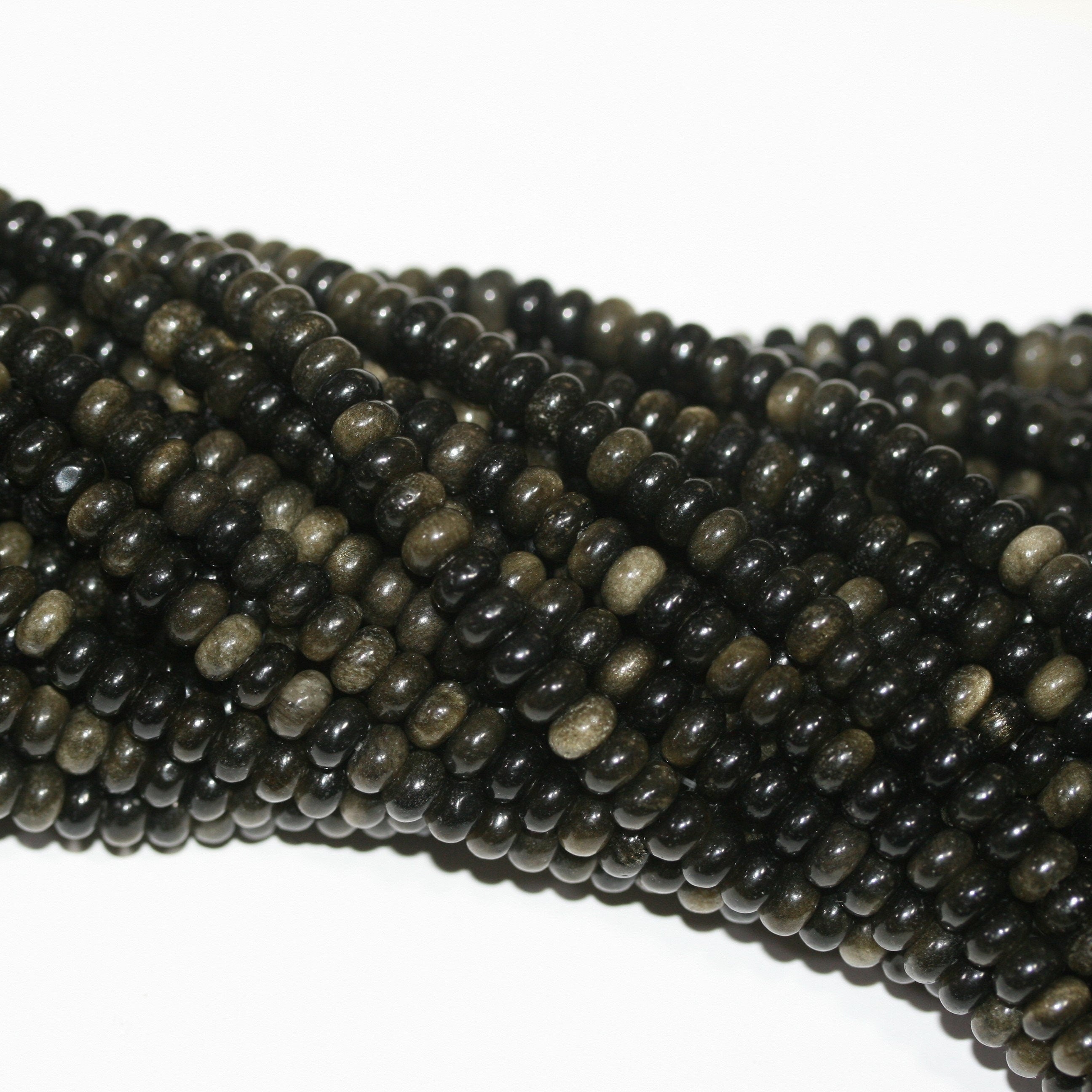 Perles rondelles lisses en obsidienne St 15" 6x4mm.- Brin 39cm.