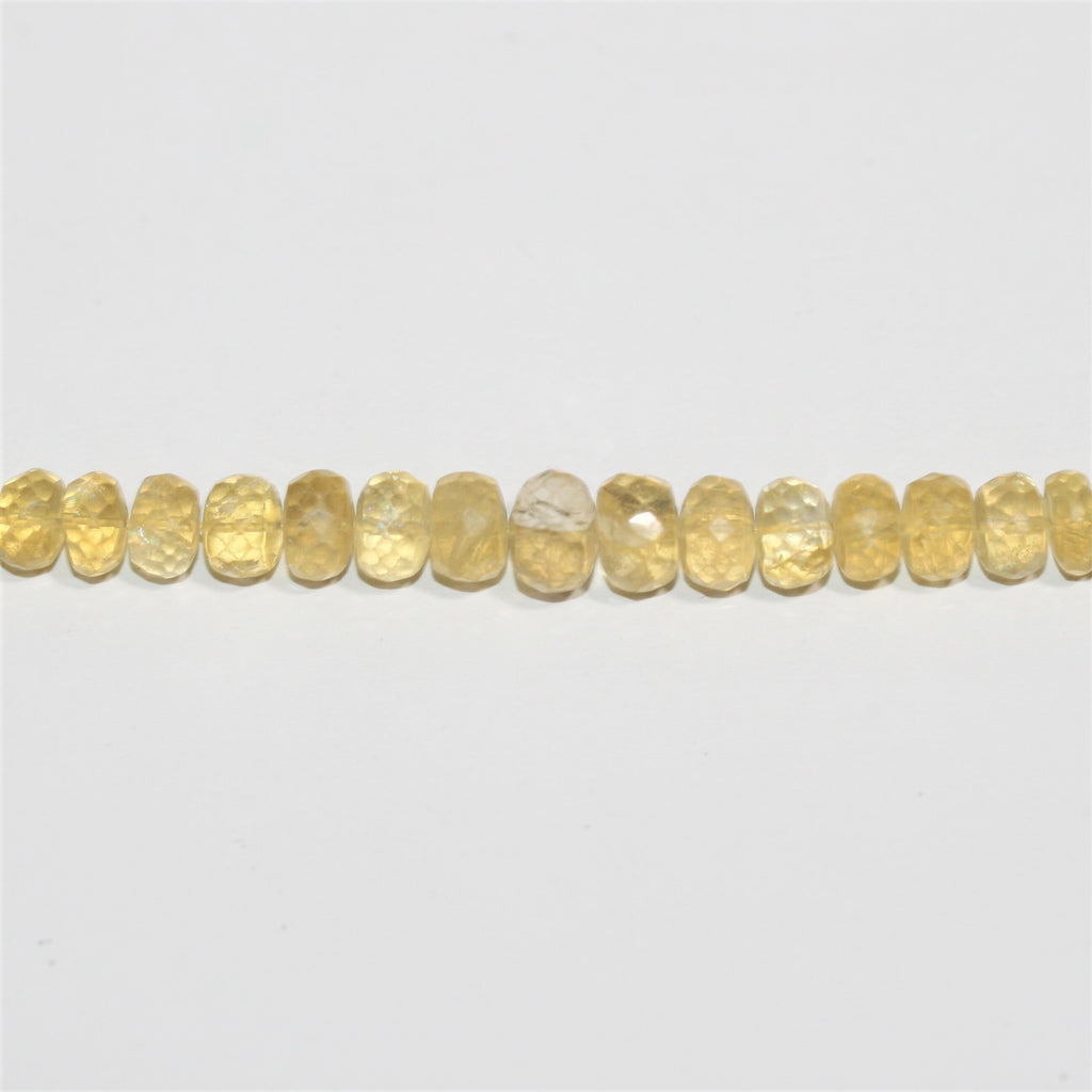 Perles rondelles graduées à facettes en béryl jaune 5x3-10x7mm. Longueur approximative du fil : 40 cm.