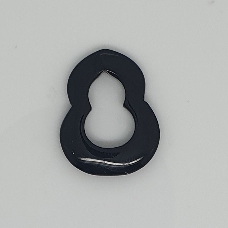 Pendentif ovale lisse en onyx 25x20mm.