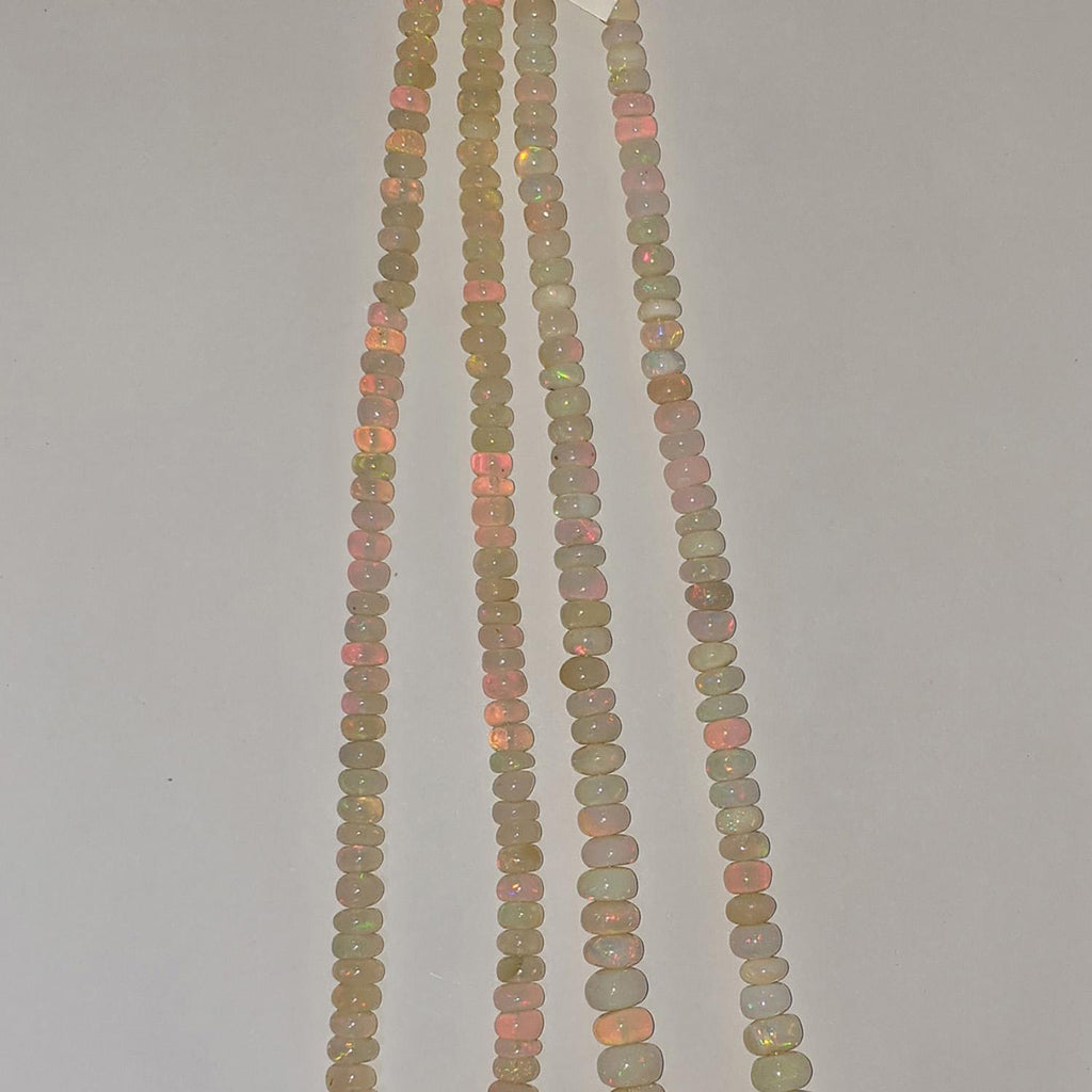 Perles rondelles lisses dégradées en opale éthiopienne St, 16 pouces (40,6 cm), 5 x 2 à 9 x 6 mm environ. Longueur du fil : 42 cm.